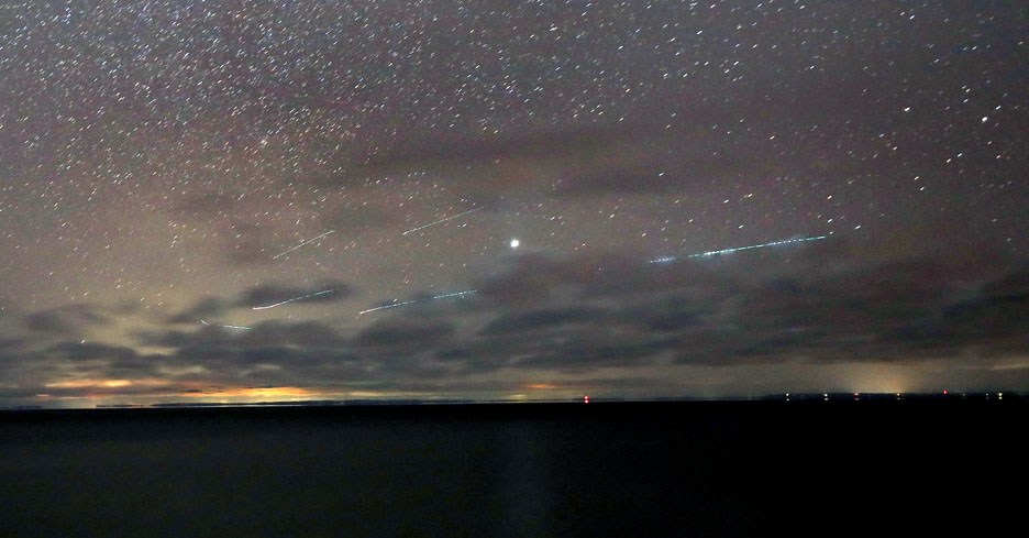 The shower reflecting on a lake. Credit: Bob King.