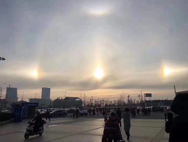 This photo, captured by an eye witness, show the two extra suns on either side of the actual visible in the Chinese city of Khorgas