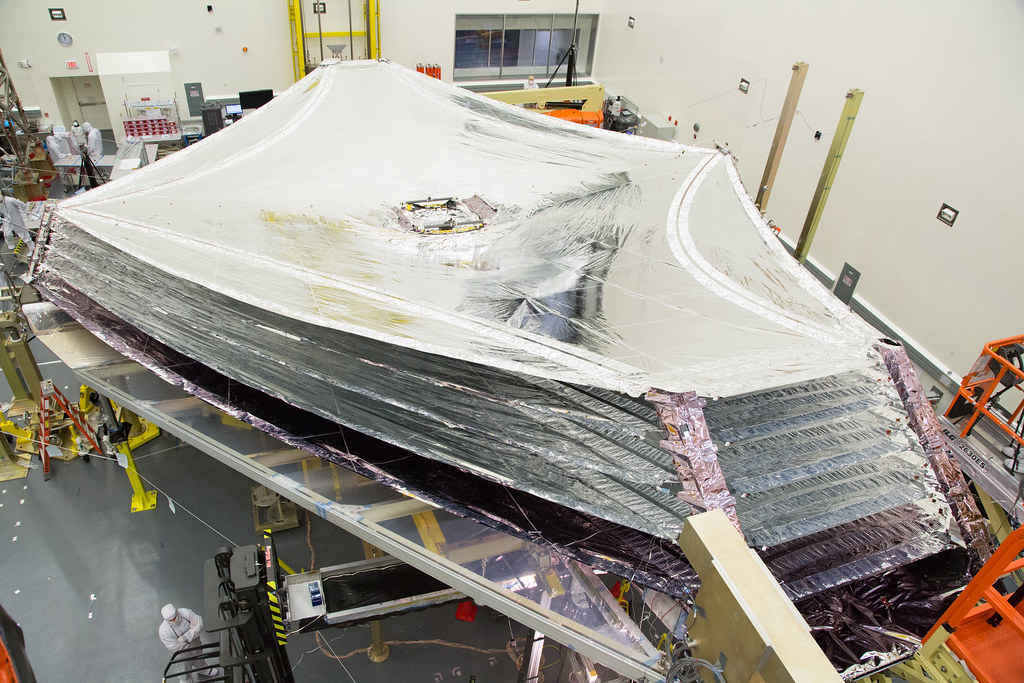 The five-layer sun shield will keep the sunlight from interfering with the sensitive JWST instruments. (Northop Grumman)