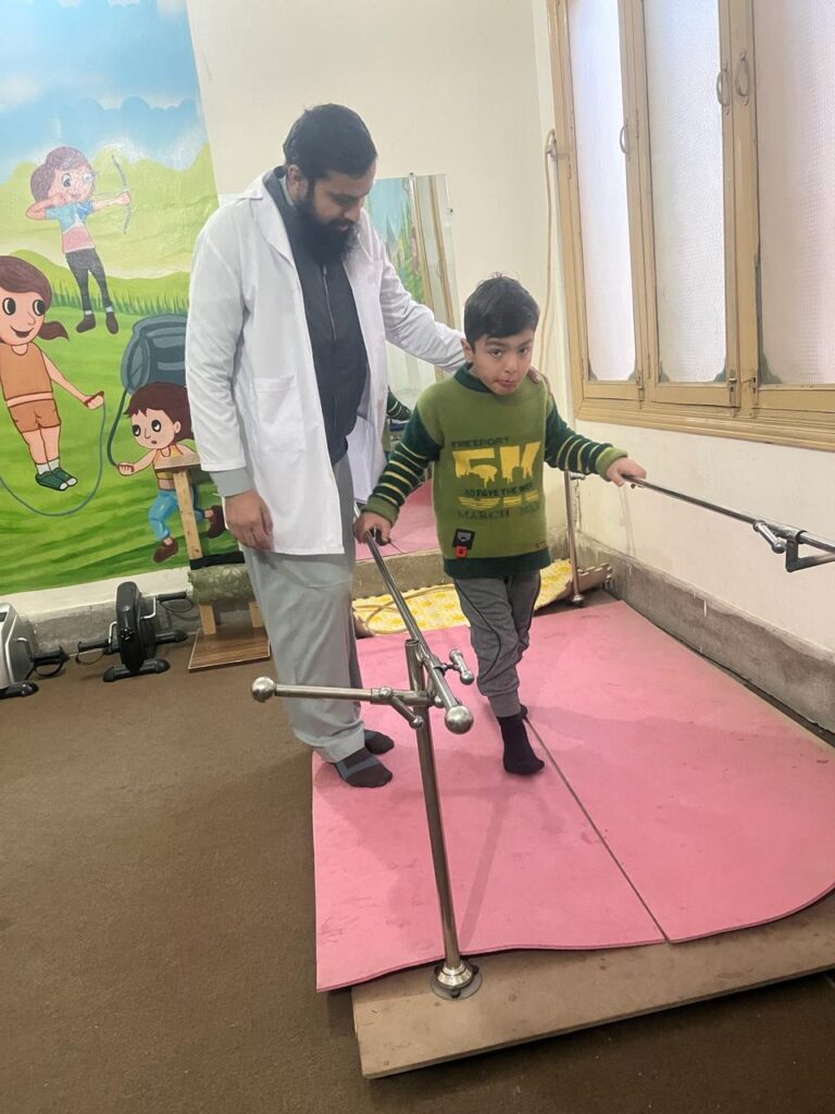 An autistic boy attending a physiotherapy session in Peshawar. Photo, Author